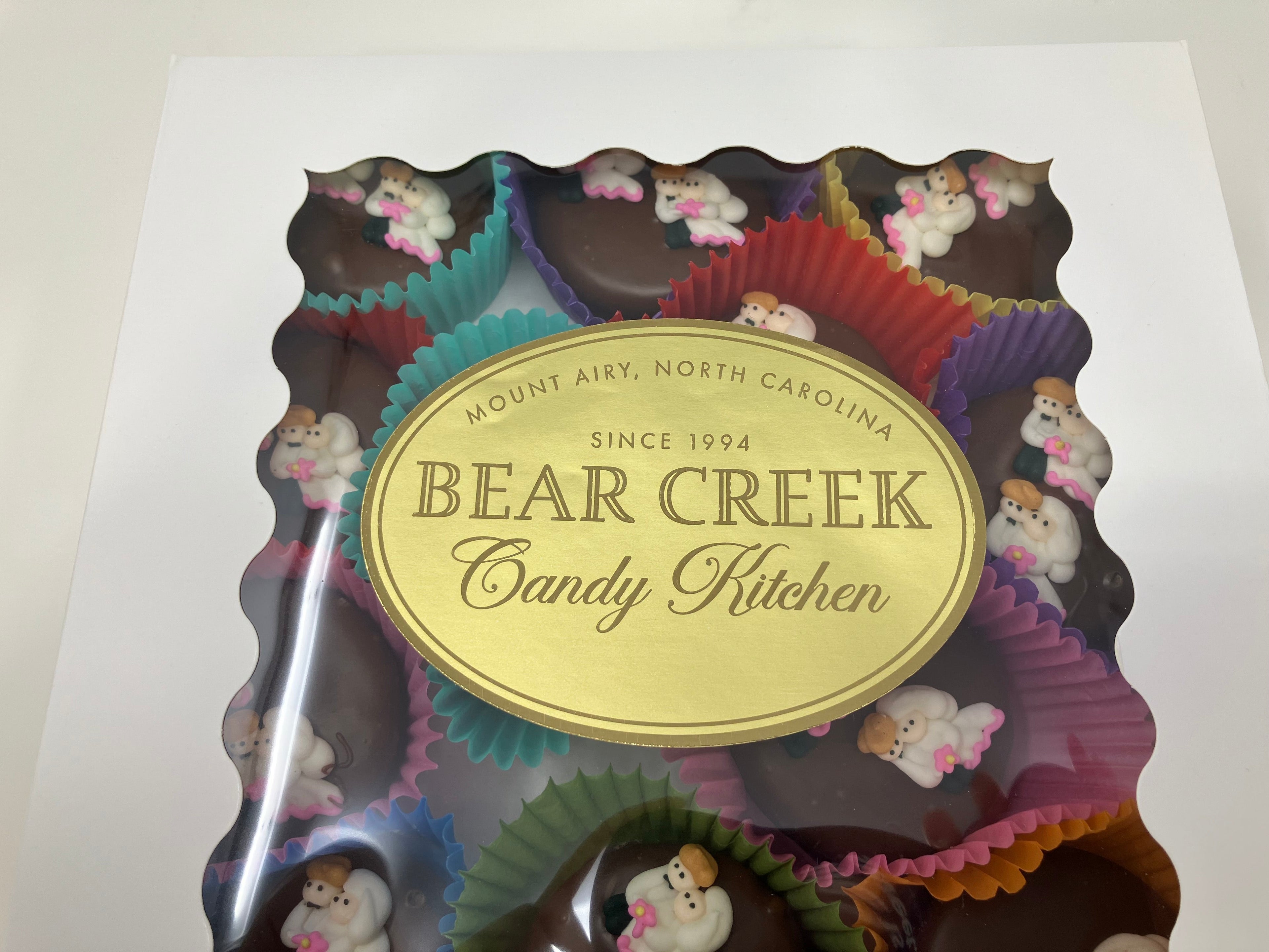 Bear Creek Candy Kitchen product packaging with colorful candy designs on a white background