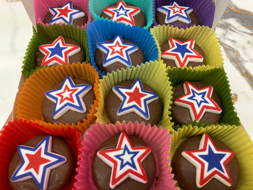Chocolate candies with star designs in colorful wrappers