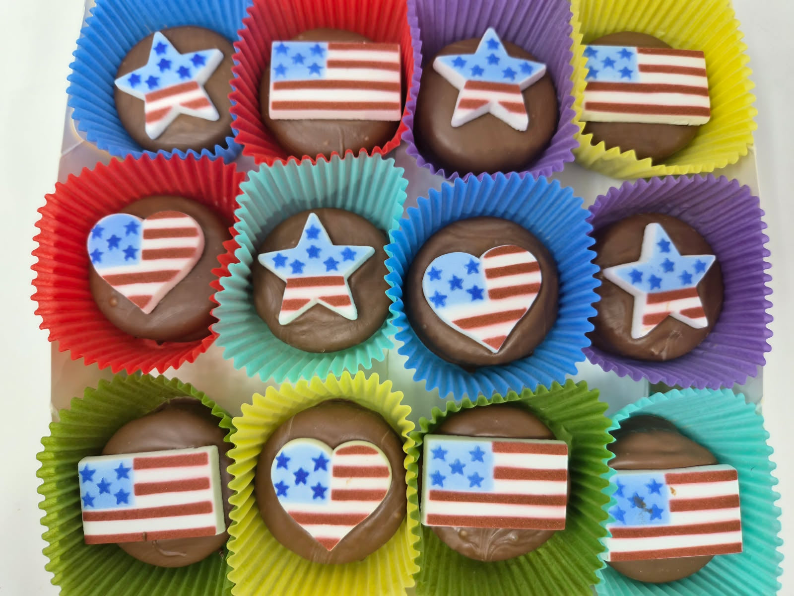 Assorted chocolate candies with American flag designs in colorful wrappers.