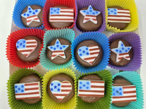 Assorted chocolate candies with American flag designs in colorful wrappers.
